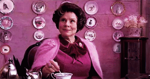 Dolores Umbridge Stirring Coffee