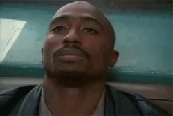 2pac-tupac-shakur-stare-9dfiabdw8s93n00k.gif