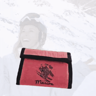 A 50 Euro Bill Next To A Red Wallet With The Name Marion On It GIF