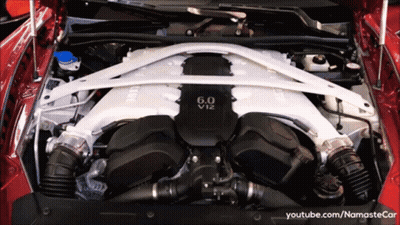 A 6.0 V12 Engine Is Shown With The Hood Up GIF