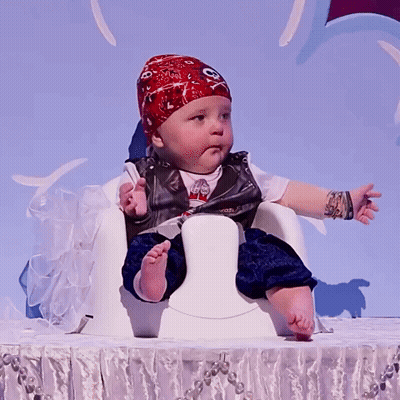 A Baby Dressed As A Pirate With A Bandana On His Head GIF