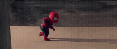 A Baby Dressed In A Spiderman Costume Is Running GIF