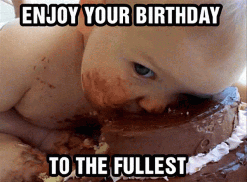 A Baby Eating A Chocolate Cake With The Words Enjoy Your Birthday To The Fullest GIF