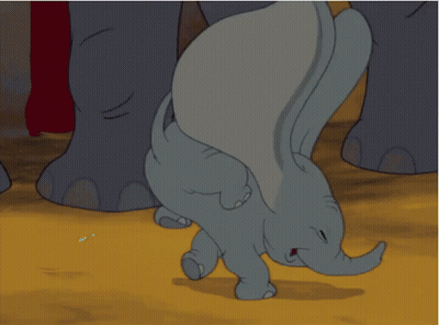 A Baby Elephant Is Crawling On The Ground With Its Trunk Outstretched GIF