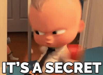 A Baby From The Boss Baby Movie Is Standing In A Doorway And Says `` It 'S A Secret '' . GIF