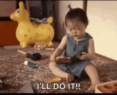 A Baby Girl Is Sitting On The Floor Playing With Toys And Saying `` I 'Ll Do It '' . GIF