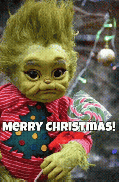 A Baby Grinch Holding A Lollipop With The Words Merry Christmas Below GIF