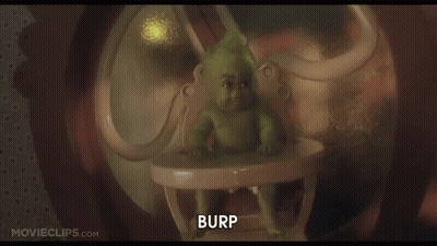 A Baby Grinch Is Sitting In A High Chair With The Words Burp Below Him GIF