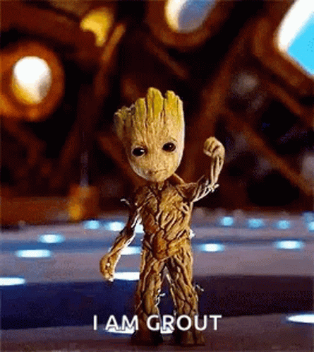 Baby Groot Standing In Front Of Building Says I Am Groot GIF