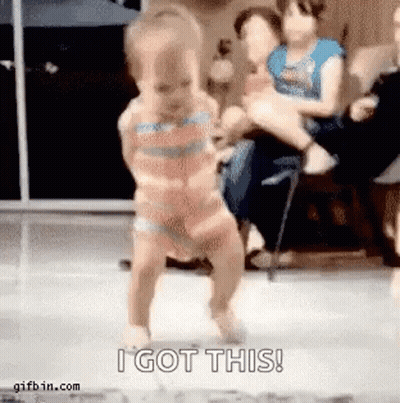 A Baby In A Bikini Is Dancing In Front Of A Crowd . GIF