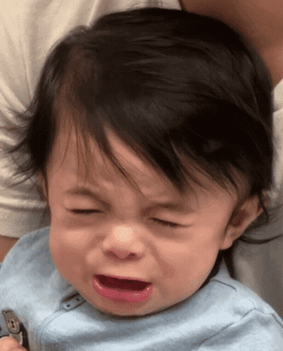 A Baby In A Blue Shirt Is Crying GIF