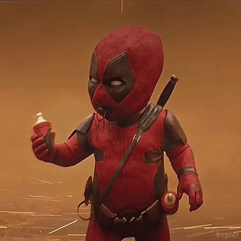 A Baby In A Deadpool Costume Holding A Bottle GIF