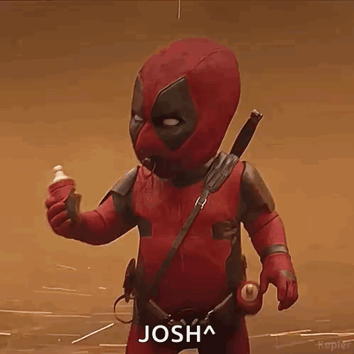A Baby In A Deadpool Costume Is Holding A Bottle Of Milk . GIF