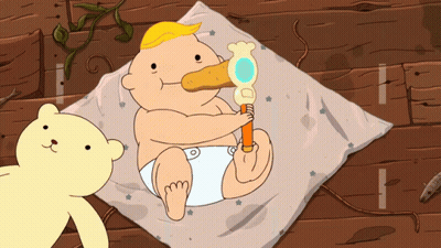 A Baby In A Diaper Is Holding A Toy And A Yellow Teddy Bear Looks On GIF