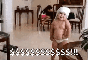 A Baby In A Diaper Is Standing In A Living Room With A Towel On His Head . GIF