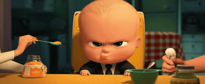 A Baby In A High Chair Is Being Fed By A Woman With A Spoon GIF