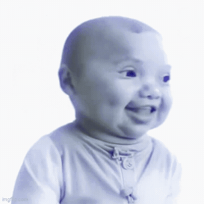 A Baby In A White Shirt Is Smiling And Looking At The Camera GIF