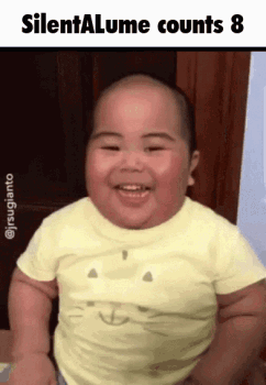 A Baby In A Yellow Shirt Is Smiling With The Words Silentalume Counts 8 Below It GIF