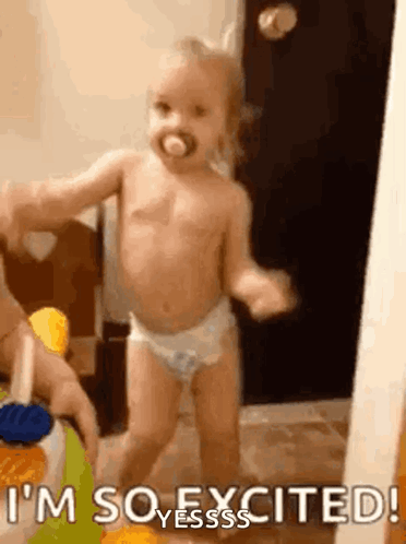 A Baby In Diapers Is Dancing With A Pacifier In Her Mouth . GIF
