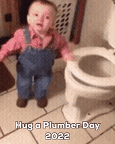 A Baby In Overalls Is Standing Next To A Toilet And Says Hug A Plumber Day 2022 GIF