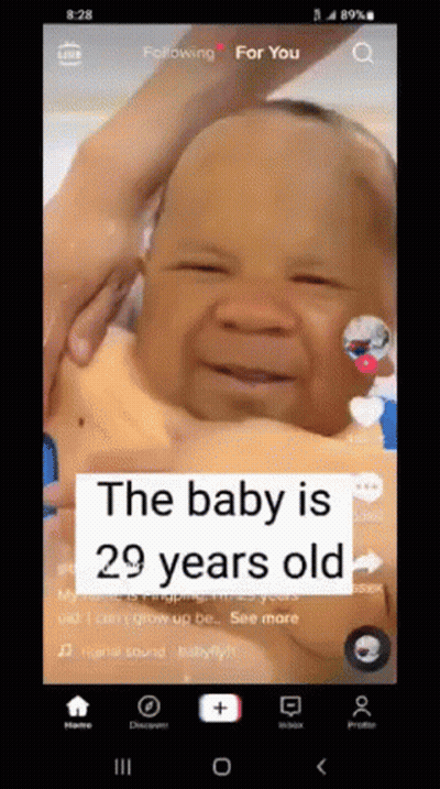 A Baby Is 29 Years Old And Is Being Held In Someone 'S Arms GIF