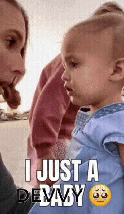 A Baby Is Being Held By A Woman With The Caption " I Just A Debaby " GIF