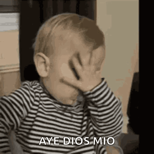 A Baby Is Covering His Face With His Hand And Saying Aye Dios Mio GIF