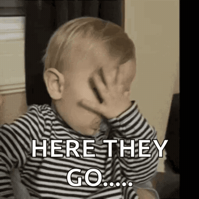 A Baby Is Covering His Face With His Hand And Saying `` Here They Go ... '' . GIF