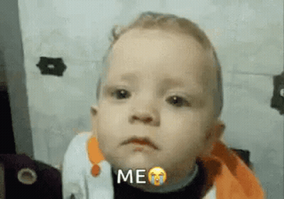 A Baby Is Crying And Making A Funny Face With The Words `` Me '' . GIF