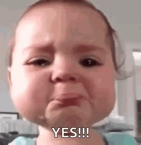A Baby Is Crying And Making A Funny Face . GIF