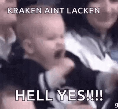A Baby Is Crying In A Crowd Of People And A Woman Is Holding Him . GIF