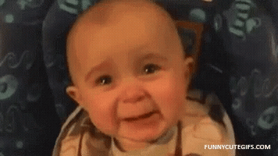 A Baby Is Crying In A High Chair . GIF