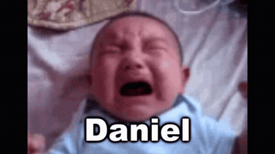 A Baby Is Crying On A Bed With The Name Daniel . GIF