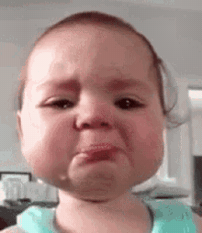 A Baby Is Crying With A Tear Coming Out Of Her Nose . GIF