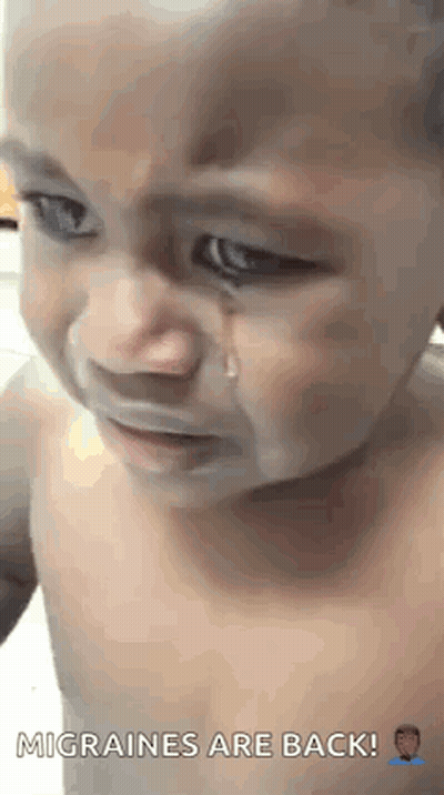 A Baby Is Crying With A Tear Coming Out Of His Eyes . GIF