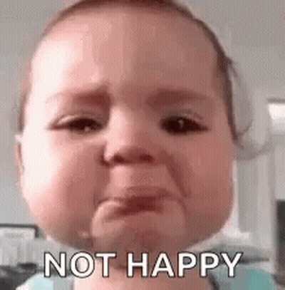 A Baby Is Crying With The Words `` Not Happy '' Written On Its Face . GIF