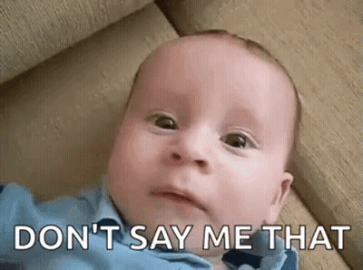 A Baby Is Laying On A Couch And Making A Funny Face With The Words `` Don T Say Me That '' . GIF