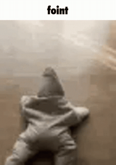 A Baby Is Laying On The Floor In A Star Shaped Outfit . GIF