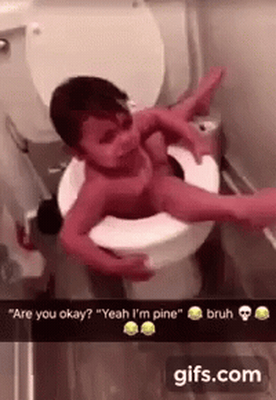 A Baby Is Laying On Top Of A Toilet With A Person Holding It . GIF