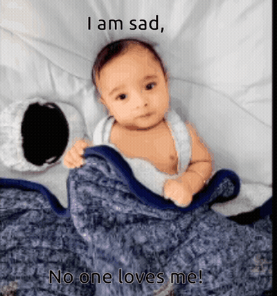 A Baby Is Laying Under A Blanket With The Caption I Am Sad GIF
