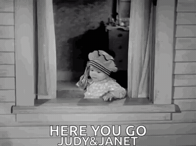 A Baby Is Looking Out Of A Window With The Words `` Here You Go Judy & Janet '' . GIF