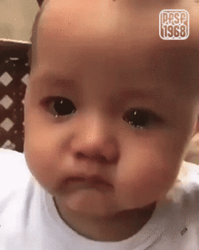 A Baby Is Making A Funny Face And Has The Year 1968 On It GIF