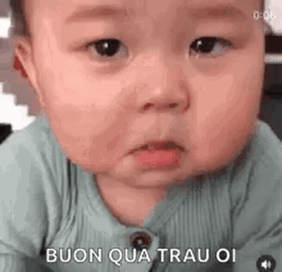 A Baby Is Making A Funny Face And Making A Funny Face With His Mouth Open . GIF