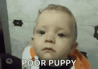 A Baby Is Making A Funny Face And Says `` Poor Puppy '' . GIF