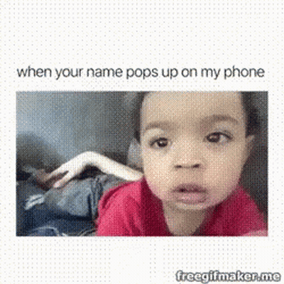 A Baby Is Making A Funny Face While Looking At The Camera . GIF