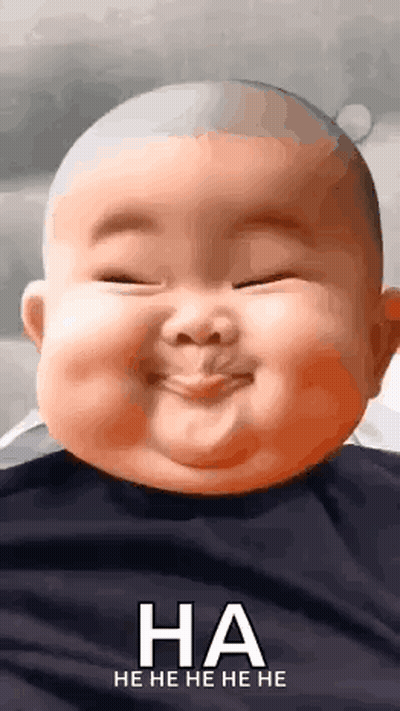 A Baby Is Making A Funny Face With His Eyes Closed And Laughing . GIF