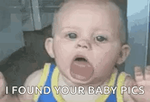 A Baby Is Making A Funny Face With His Tongue Out . GIF