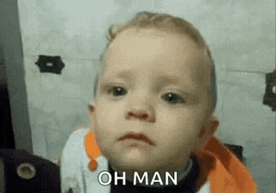 A Baby Is Making A Sad Face And Saying Oh Man . GIF