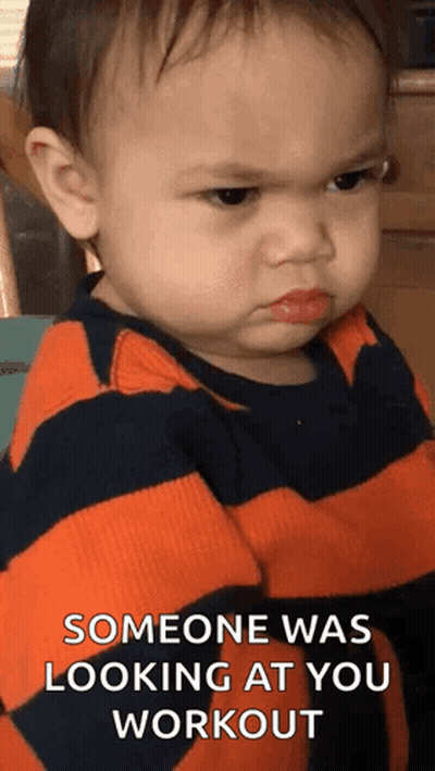 A Baby Is Making An Angry Face And Says `` Someone Was Looking At You Workout '' GIF