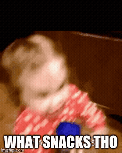 A Baby Is Playing With A Blue Object And The Words What A Snacks Tho Are Visible GIF